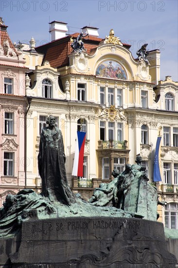 CZECH REPUBLIC, Bohemia, Prague, "The monument to the 15th Century religious reformer and local hero, Jan Hus, in front of the Art Nouveau Ministry of Local Development in the Old Town Square"