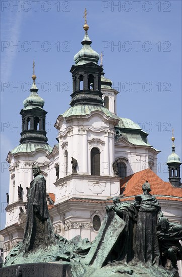 CZECH REPUBLIC, Bohemia, Prague, "The monument to the 15th Century religious reformer and local hero, Jan Hus, in front of the Baroque Church of St Nicholas in the Old Town Square"