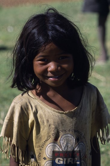 MADAGASCAR, Peope, Children, Portrait of a smiling child wearing a dirty t shirt printed with the slogan Pretty Girl