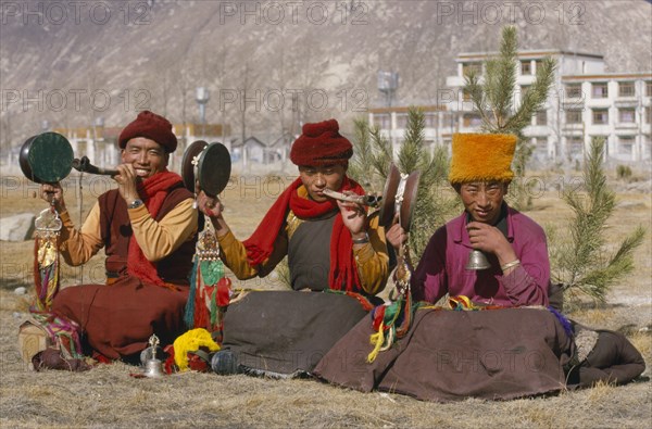 CHINA, Tibet, Lhasa, "Monk musicians, two of which are playing horns made from human thigh bones, near the Potala Palace."
