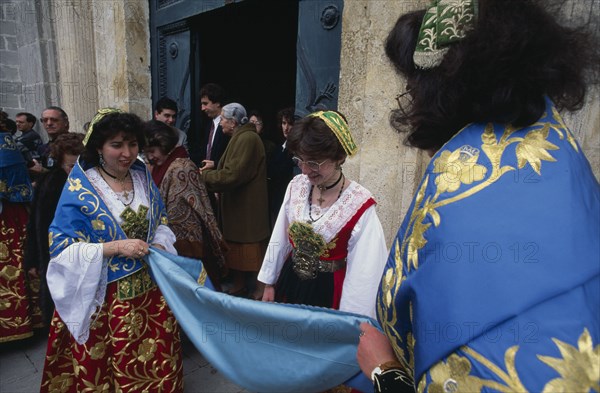 ITALY, Sicily, Palermo, Piana Degli Albanesi.  Women celebrating Easter wearing traditional costume.