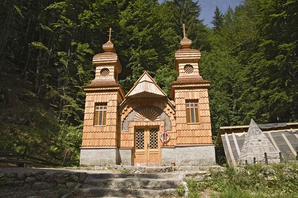 SLOVENIA , Triglav National Park, Julian Mountain Range, Ruska Kapelica The Russian Chapel 1915 -17 - the pyramid on the right is a memorial to 100 Russian Prisoners of War killed in an avalanche whilst building the road through the Julian Alps