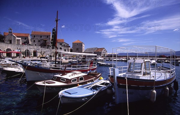 CROATIA, Dalamatia, Brac, "Bol, boats in marina. The marina in the small village isolated on the islands southern coast is filled with fishing boats aswell as schooners and yachts "