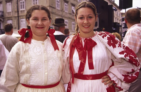 CROATIA, Kvarner, Rijeka, "Habsburg jubilee, girls in traditional costume. The streets are a riot of colour as the city celebrates its Habsburg heritage"