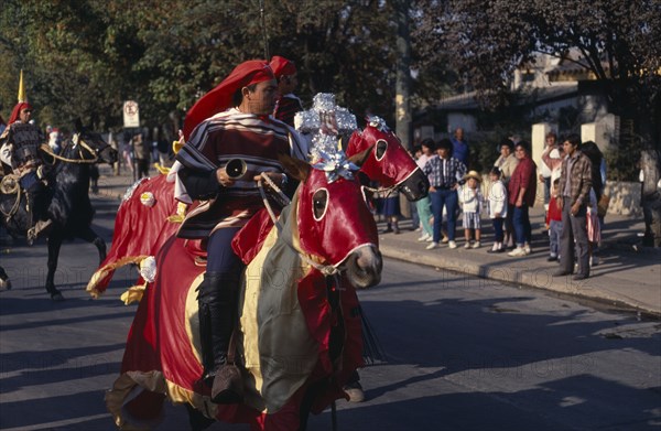 CHILE, Santiago, "La Barnechea.  Horse and riders in costume at the Fiesta de Cuasimodo, traditional festival held one week after Easter."