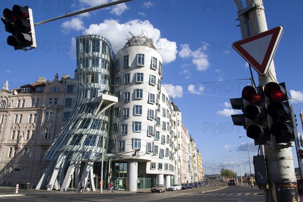 CZECH REPUBLIC, Bohemia, Prague, "The Rasin Building in the New Town locally known as ""Ginger and Fred"" after the dancing movie stars. Designed by Frank O. Gehry and local architect Vladimir Milunic the building stands on the banks of the Vltava River by the Jiraskuv Bridge"