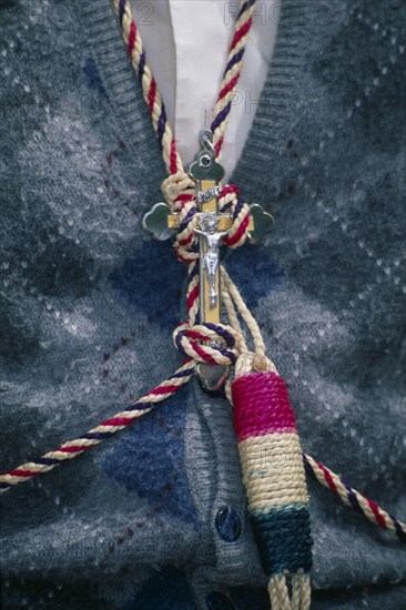 MEXICO, Guanajuato, San Miguel de Allende, Atotonilco Sanctuary.  Close cropped view of the crucifix and ‘Disciplina’ or whip worn around the neck of a penitent.