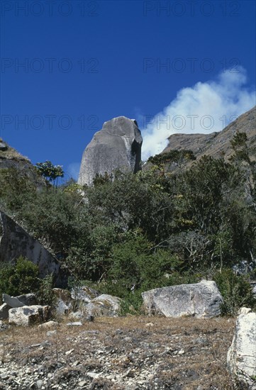 COLOMBIA, Sierra Nevada de Santa Marta, Valley of Surlivaka, Surlivaka an important Kogi religious centre on southern side of the Sierra.  Impressive and sacred granite boulder stands at side of track climbing up to the centre at c.4500m. The Kogi do not allow blancos/whites to visit their religious sites