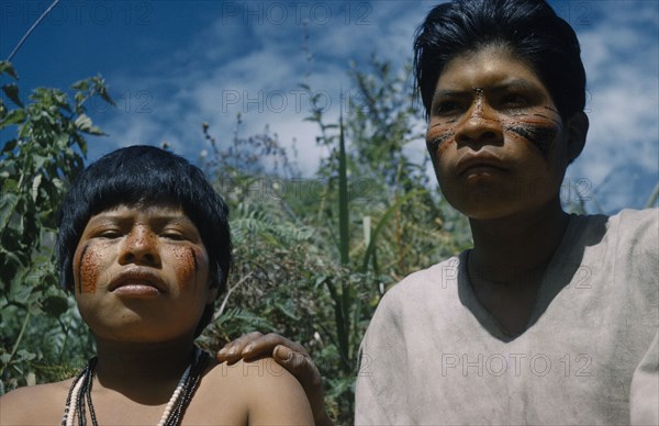 COLOMBIA, Sierra de Perija, Yuko - Motilon , Gabriel and wife with red “Achiote” and black fungal facial paint