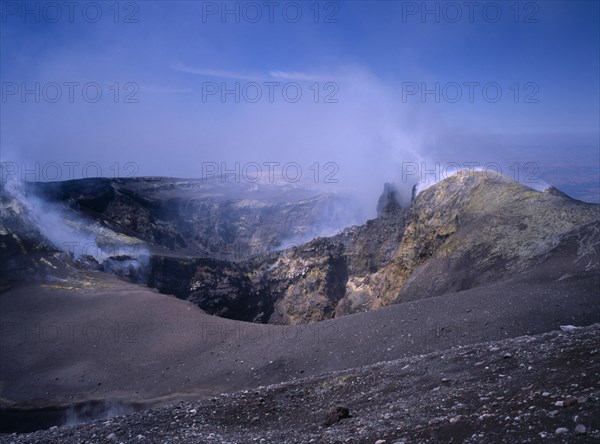 ITALY, Sicily, Mount Etna, Sulphur coated edge of the smoking summit crater
