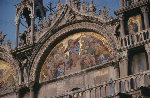 ITALY, Veneto, Venice, St Marks Square.  Detail of mosaic and carvings on exterior facade of Basilica di San Marco.