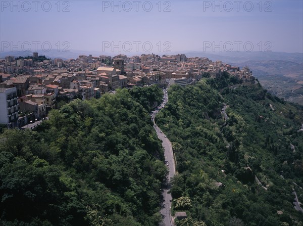 ITALY, Sicily, Enna Province, "A road leading to the city , view West over the rooftops from Castello di Lombardia. The highest provincial capitol in Italy"