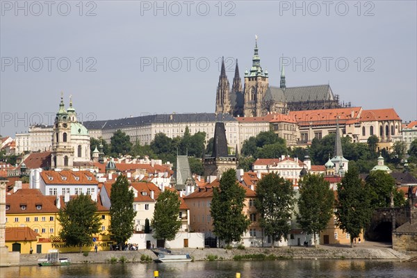 CZECH REPUBLIC, Bohemia, Prague, View across the Vtlava River to the Little Quarter and St Vitus Cathedral in Prague Castle