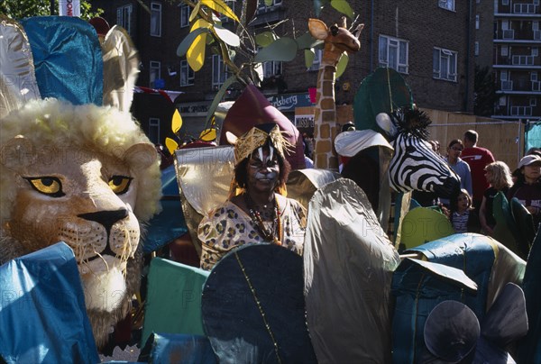 ENGLAND, London, Notting Hill carnival revellers in extravagant costume