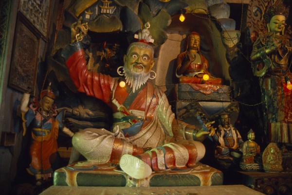 INDIA, West Bengal, Kalimpong, "Interior of the Zong Dog Palri Fobrang Monastery. Statues of various figures, some seated, some standing."