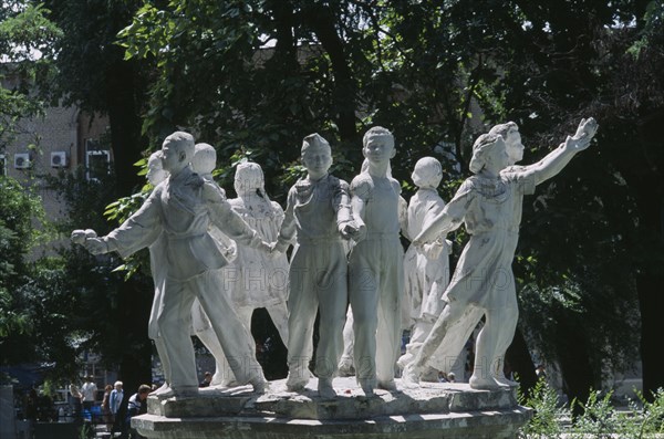 UKRAINE, Dnepropetrovsk, "Soviet era fountain of children leaning out from a circle, holding hands."
