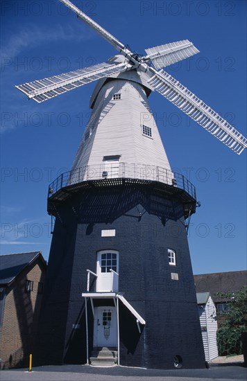 ENGLAND, Kent, Cranbrook, Union Watermill white weather boarded smock mill. It is the tallest mill in Kent at 70 ft