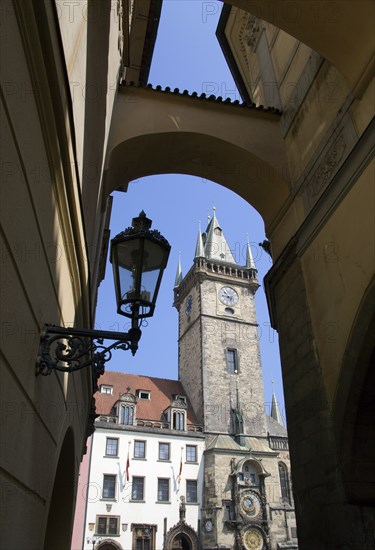 CZECH REPUBLIC, Bohemia, Prague, The Town Hall and Astronomical Clock seen through an arch in Melantrichova Passage in the Old Town