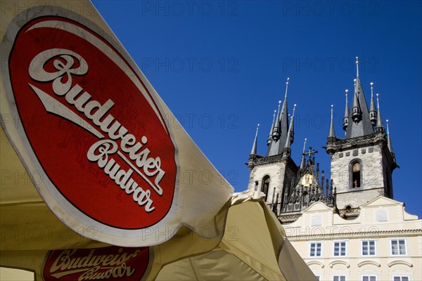 CZECH REPUBLIC, Bohemia, Prague, Restaurant umbrellas advertising the original Czech Budweiser Budvar in the Old Town Square in front of the Church of Our Lady before Tyn