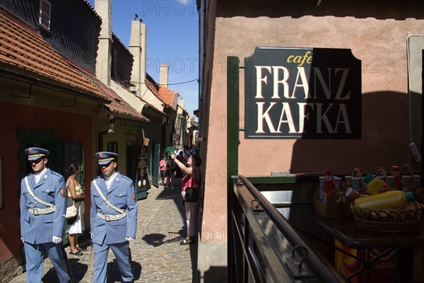 CZECH REPUBLIC, Bohemia, Prague, Golden Lane within Prague Castle in Hradcany with castle guards walking past Franz Kafka Cafe