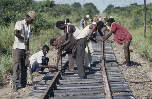 CONGO, Shaba Province, Men working on railway tracks.