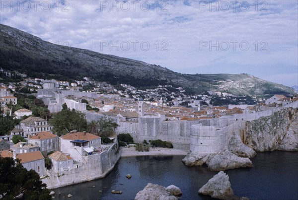 CROATIA, Dalmatia, Dubrovnik, View over the old city rooftops with the enclosed fortified walls