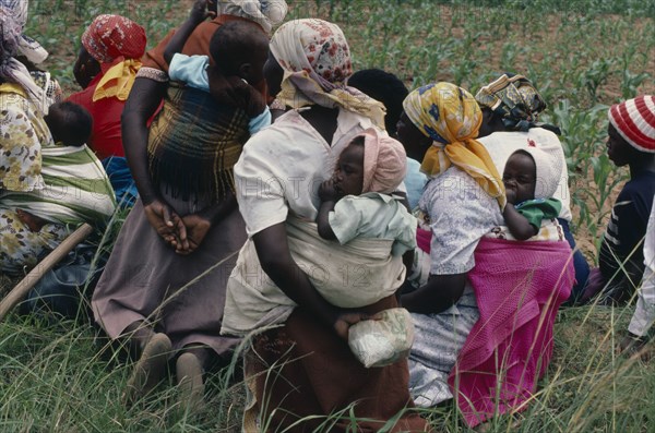 ZIMBABWE, People, "Women farmers attending a meeting of Takai da kraal agricultural co-operative, some with babies. "