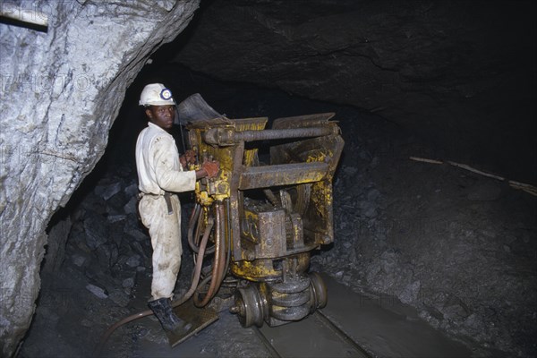 ZIMBABWE, Mashonaland East, Arcturus, Miner working underground in the Metallon Gold Zimbabwe Arcturus gold mine.