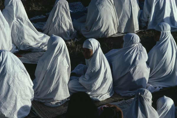 INDONESIA, Java, Yogyakarta, Young women attending dawn prayers to celebrate the end of Ramadan.