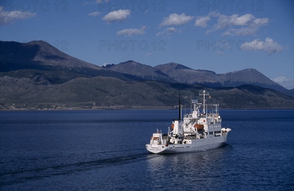 ARGENTINA, Tierra del Fuego, Ushuaia, Beagle Channel. Russian cruise ship called Multanovskiy departing from port of Ushuaia