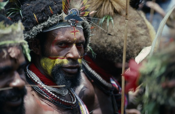 PACIFIC ISLANDS, Melanesia, Papua New Guinea, Southern Highlands. Tari. Huli Tribe Wigmen in custume with painted faces for  Sing Sing Festival.