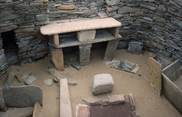 SCOTLAND, Orkney, Skara Brae, View inside one of the Neolithic stone houses in the settlement dating from 3200 to 2200 BC