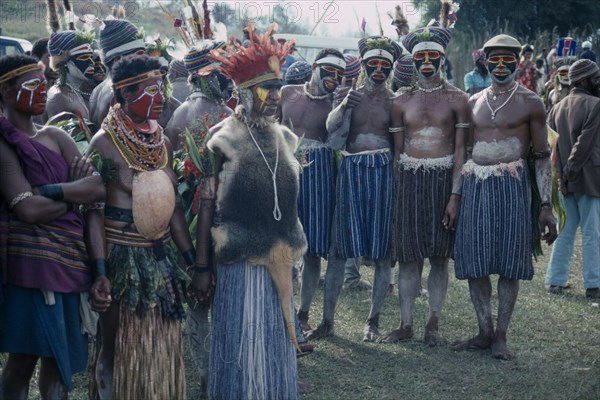 PACIFIC ISLANDS, Melanesia, Papua New Guinea, Western Highlands. Participants of Sing Sing Festival in costume with painted faces and elaborate headdresses