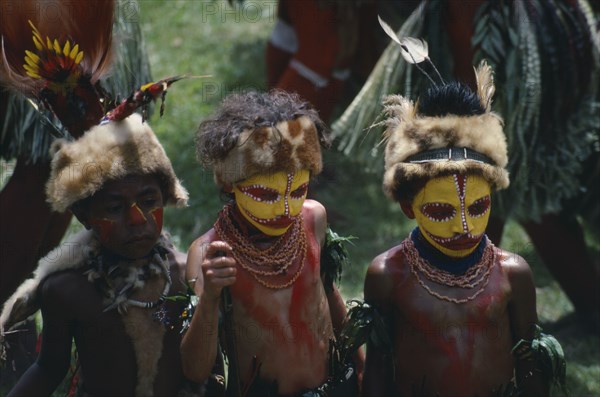 PACIFIC ISLANDS, Melanesia, Papua New Guinea, Southern Highlands. Huli Tribe The Wigmen. Children in costume with painted faces at Sing Sing Festival