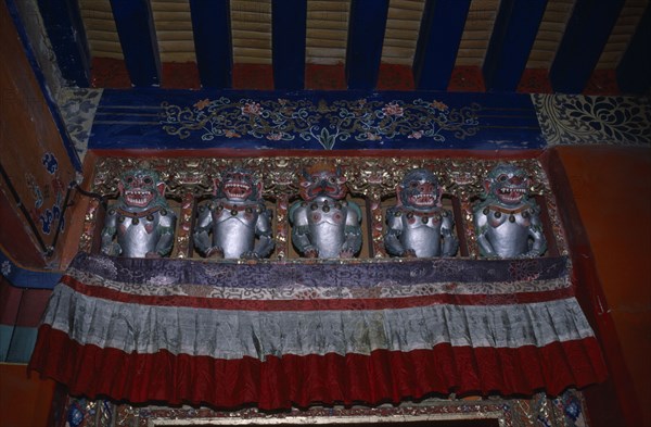 TIBET, Lahasa, The Potala Palace. Chief residence of the Dalai Lama. Detail of interior decoration with statues