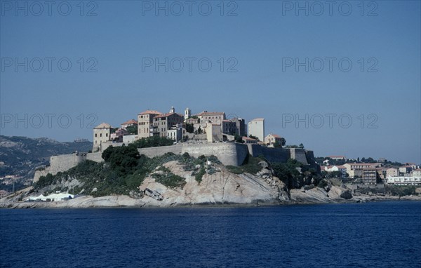 FRANCE, Corsica, Calvi, View across sea towards the fortified Citadel