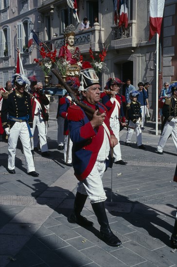 FRANCE, Provence Cote D Azur, Var, Saint Tropez. Bravade Festival with men in costume marching in a procession
