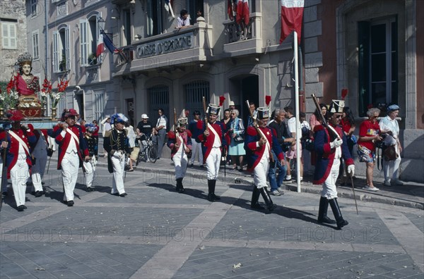 FRANCE, Provence Cote D Azur, Var, Saint Tropez. Bravade Festival with men in costume marching in a procession