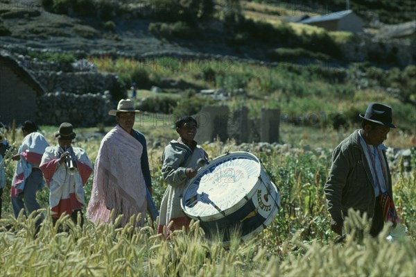 BOLIVIA, La Paz, Lake Titicaca, Musicians taking part in Harvest Festival on Island of Sun.