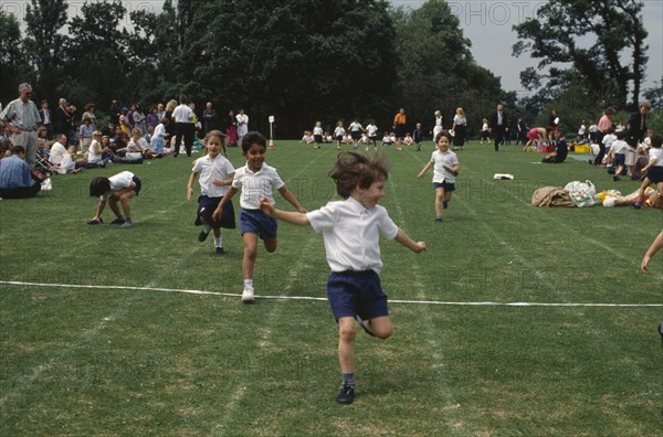 ENGLAND, Sport, Five year olds taking part in running race during school sports day.