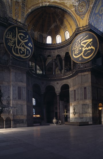 TURKEY, Istanbul, Sultanahmet.  Interior of Haghia Sophia with domed ceiling and decorative mosaic tiled walls.  Former mosque now museum.