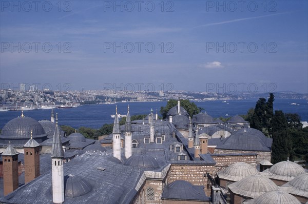 TURKEY, Istanbul, Topkapi Palace. View across rooftops of the Harem to the Bosphorous.