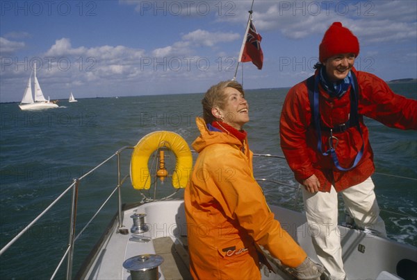ENGLAND, Dorset, Lymington, Female crew on yacht preparing for trans-Atlantic race.