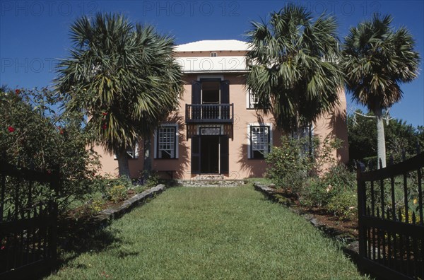 BERMUDA, Smiths Parish, Verdmont Museum exterior seen from gardens with  palm trees and flowerbeds