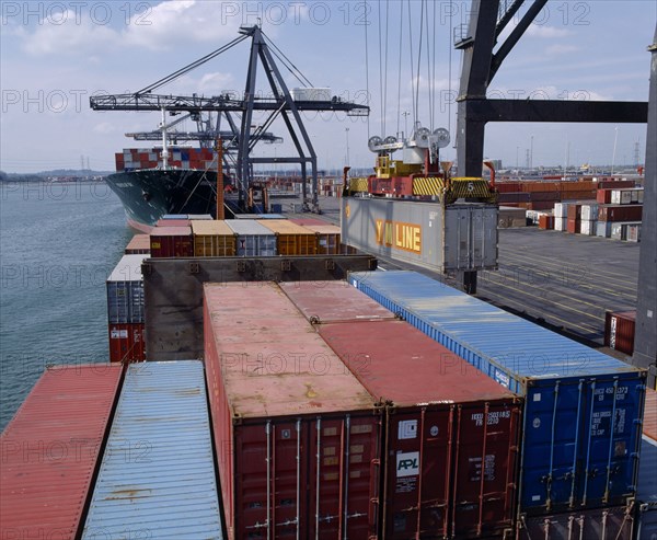 INDUSTRY, Shipping, Southampton Docks. View across shipping containers and crane machinery