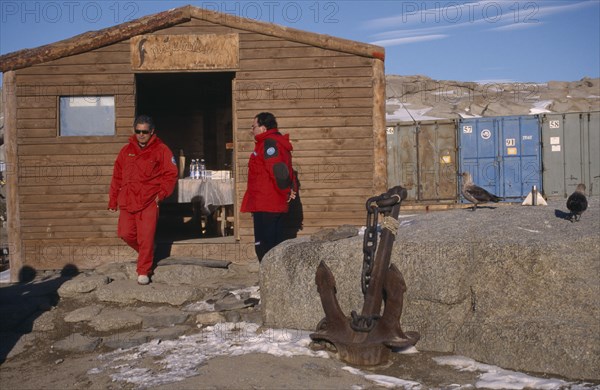ANTARCTICA, Ross Sea, Terra Nova Bay, Men in red jackets outside a coffee shop at station of Italian Antarctic Programme