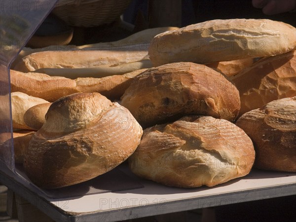 FRANCE, Deux Sevres Region, Poitiers, Different shaped bread on sale at a market stall in the town of Rouille.