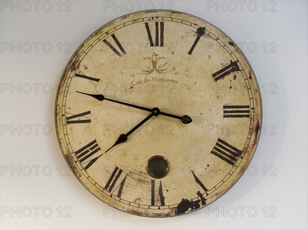 FRANCE, Deux Sevres Region, Poitiers, A classic clock face with Roman numerals against a plain background.