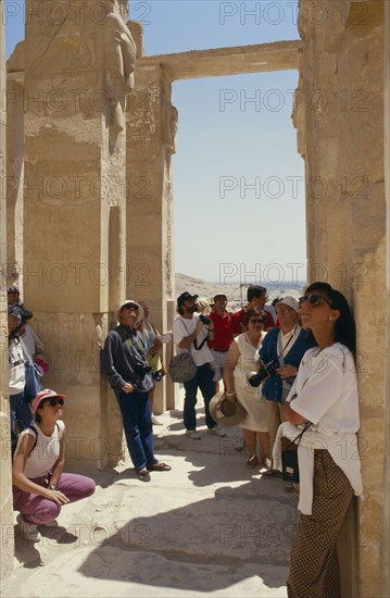 EGYPT, Nile Valley, Luxor, Tourist group visiting archaeological site.