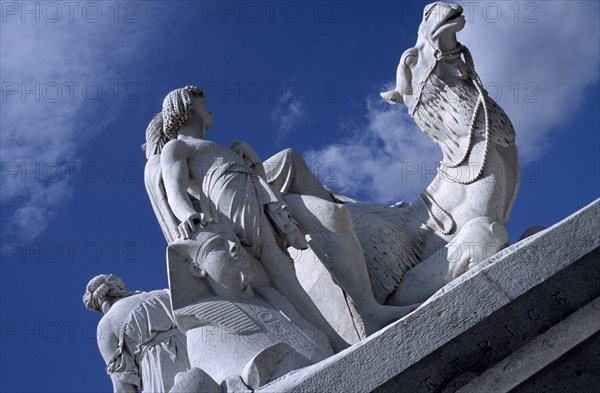 ENGLAND, London, Kensington Gardens. One of the four statues surrounding the Royal Albert Memorial depicting the four continents. Section of marble statue representing Africa.